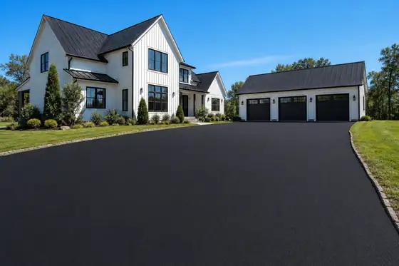 Modern farmhouse · three-car court driveway after sealcoating