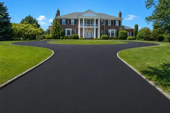 Brick colonial with circular drive driveway after sealcoating