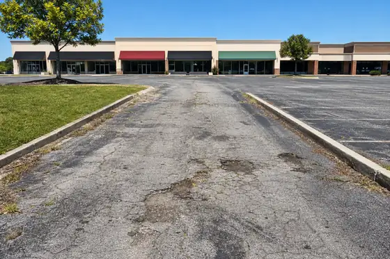 Retail strip center driveway before sealcoating